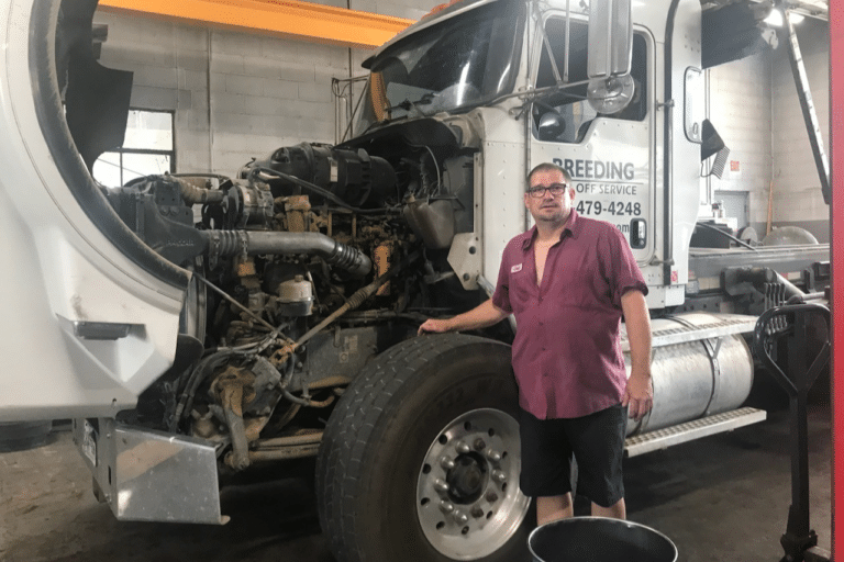 image of mlt tech working on engine and transmission overheating